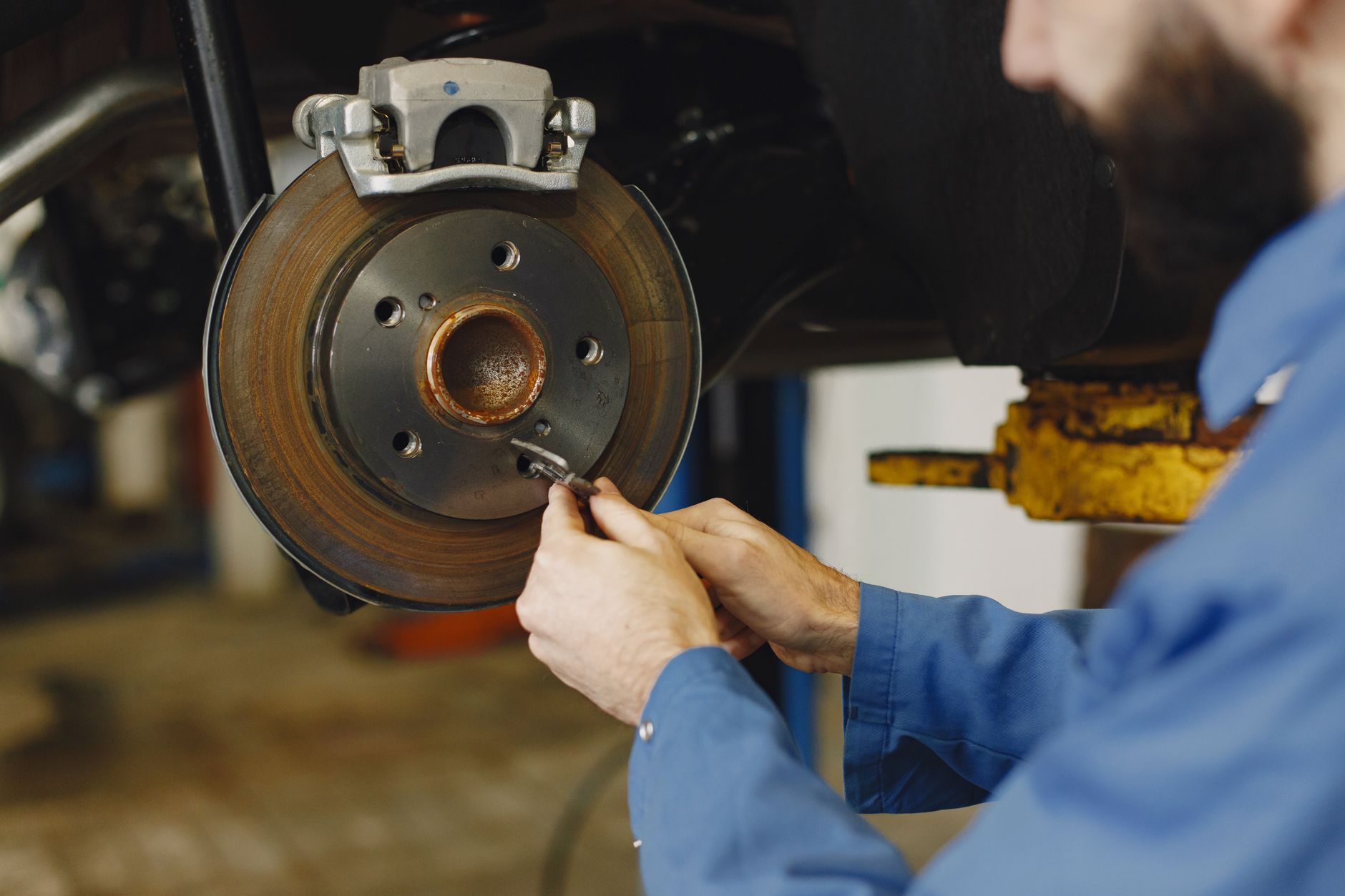 Mechanic working on a brake disc in the workshop