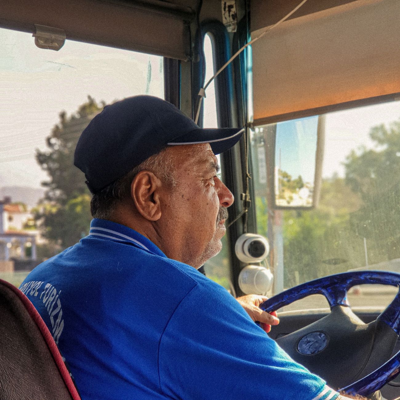 A smiling driver outdoors