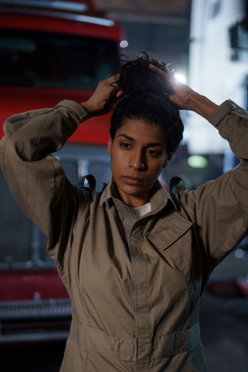 Portrait of a woman mechanic in a garage