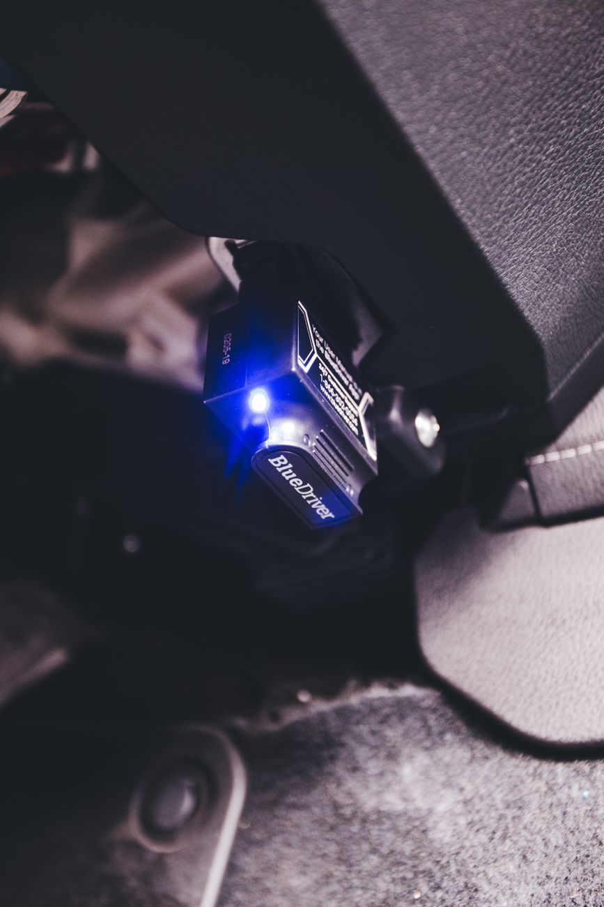 A code reader plugged into a vehicle