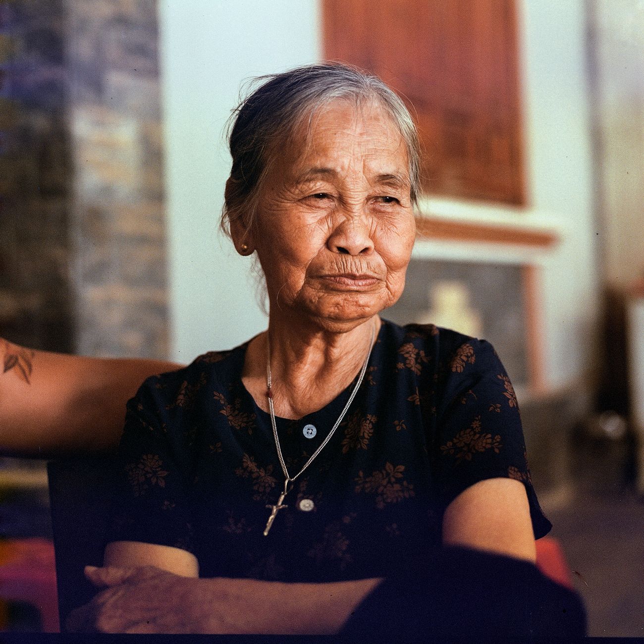 Close-up portrait of an elderly woman indoors