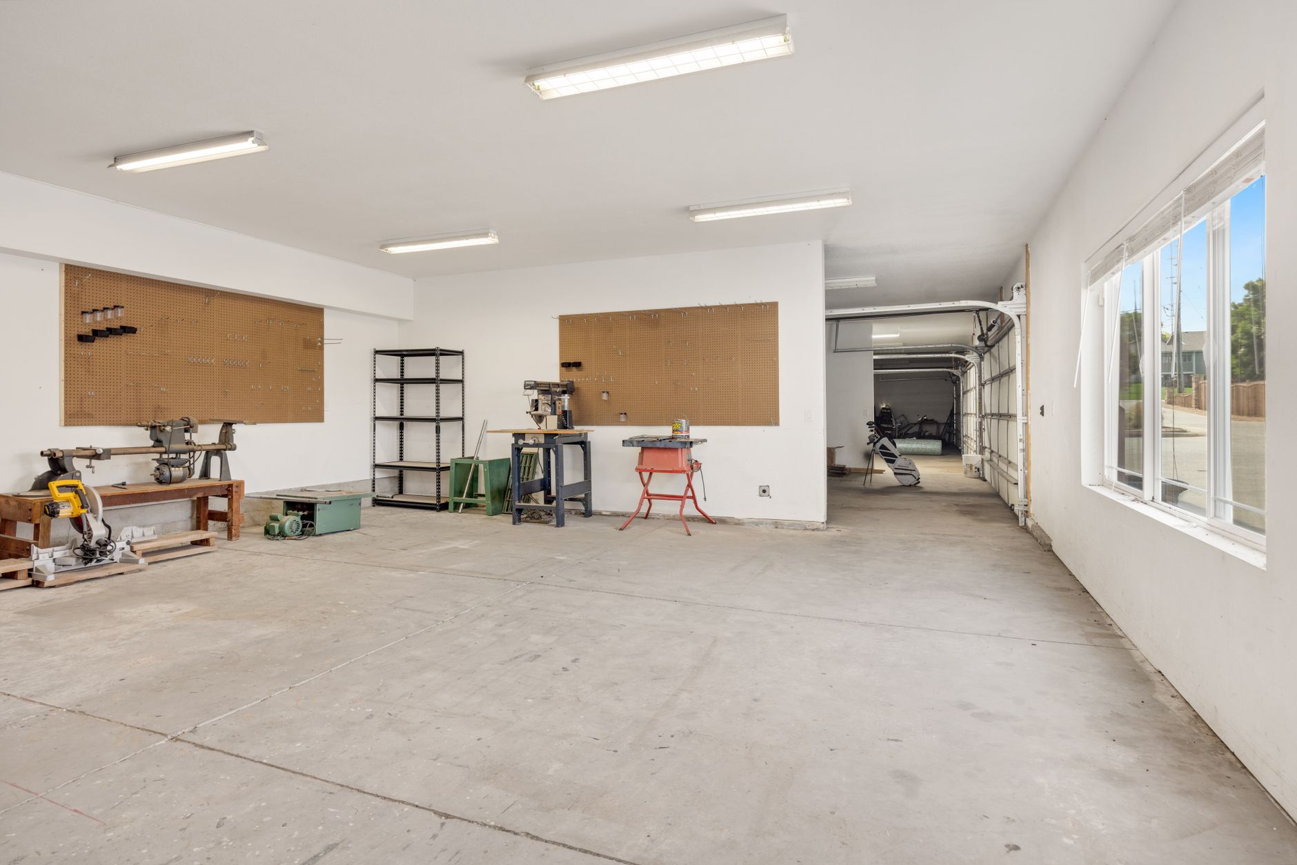 A bright, spacious workshop with machinery and tools