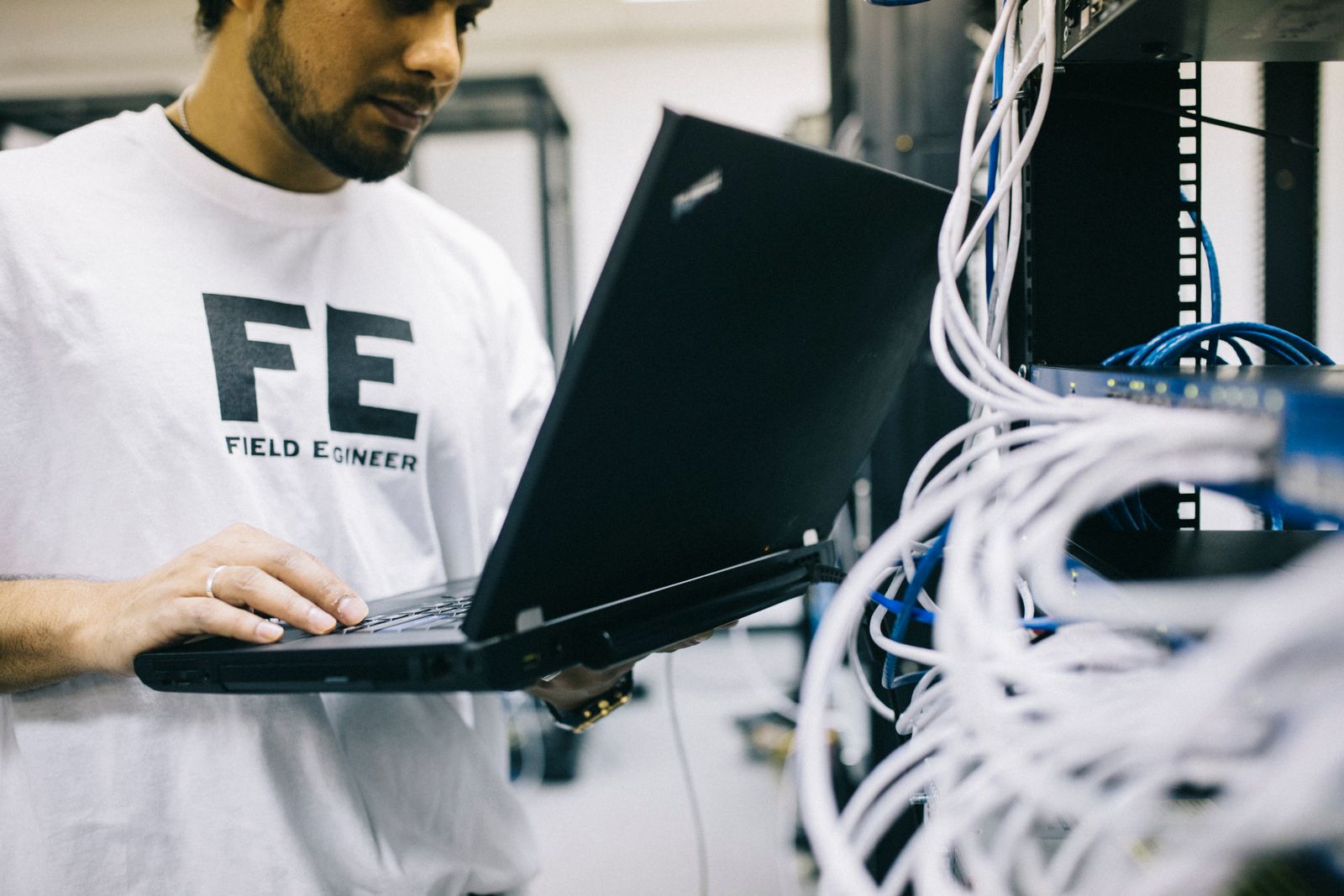 Field engineer configuring systems with a laptop